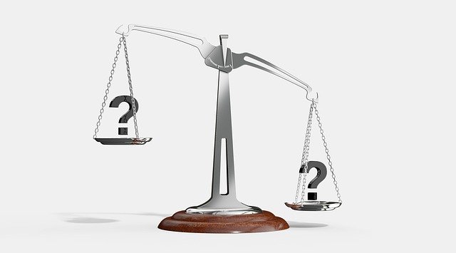 scale weighing pros and cons